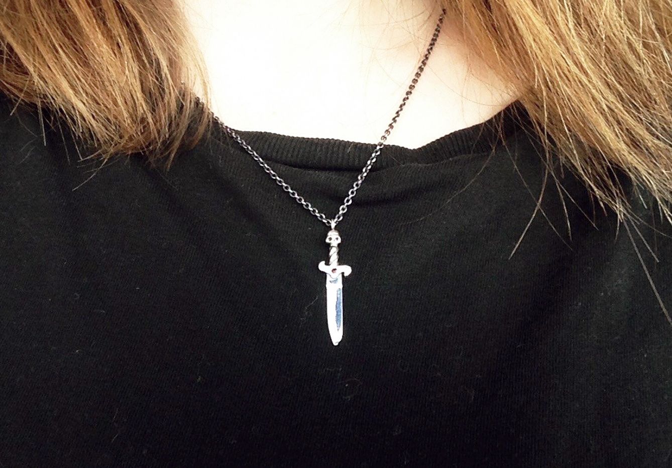 Dagger necklace being worn