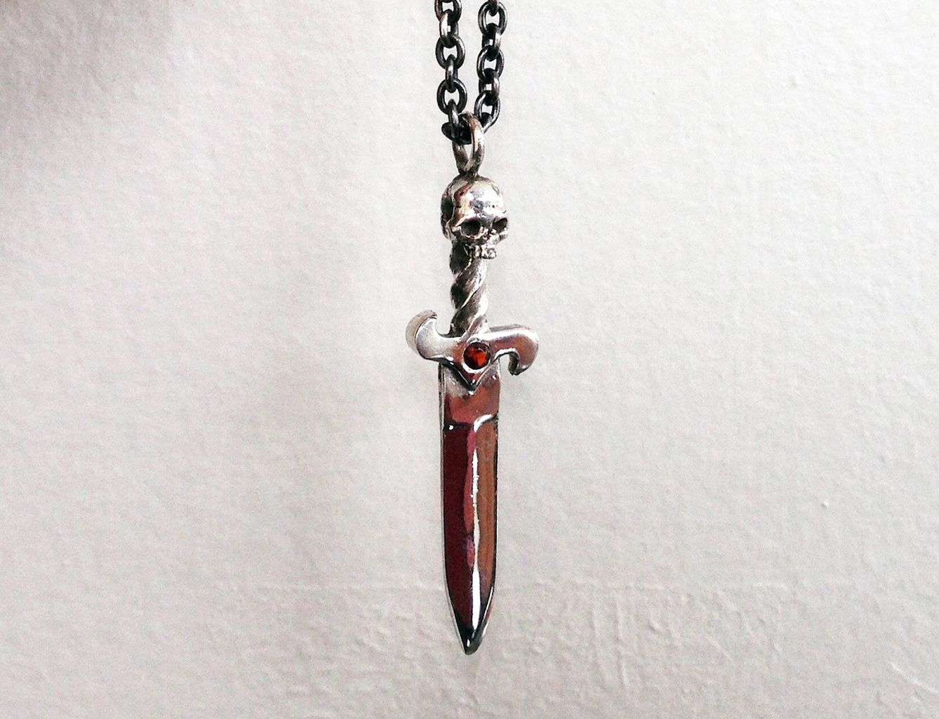 Dagger necklace with red garnet