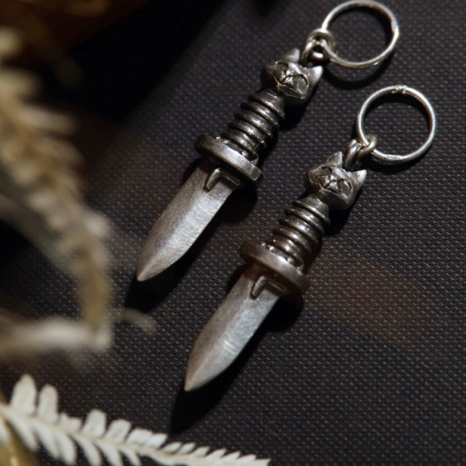 Sterling silver Gatito Blade earrings with sterling silver hoops.