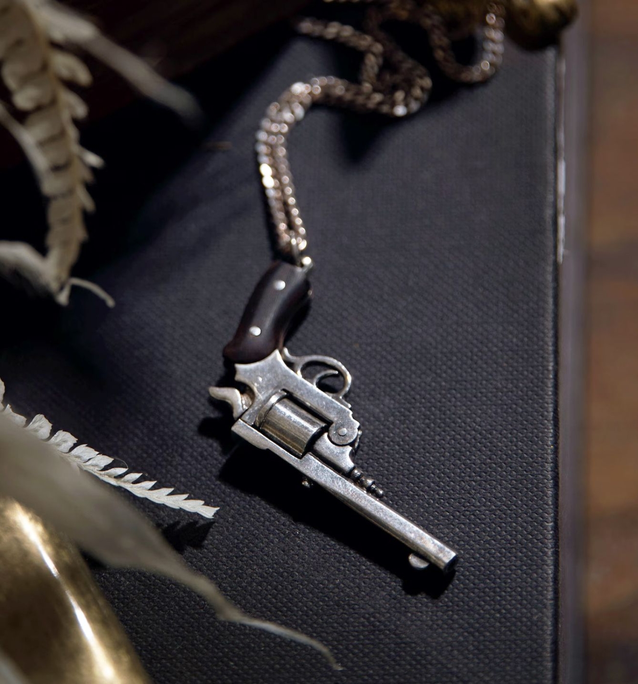 Revolver necklace with buffalo horn handle
