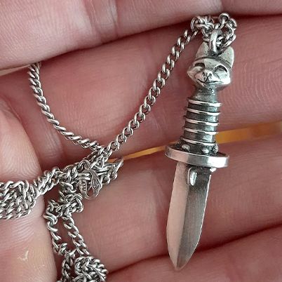 Sterling Silver Puss in Boots “Gatito Blade” necklace.
Dagger pendant is 10mm wide and 40mm long.
chain is 50cm long sterling silver.