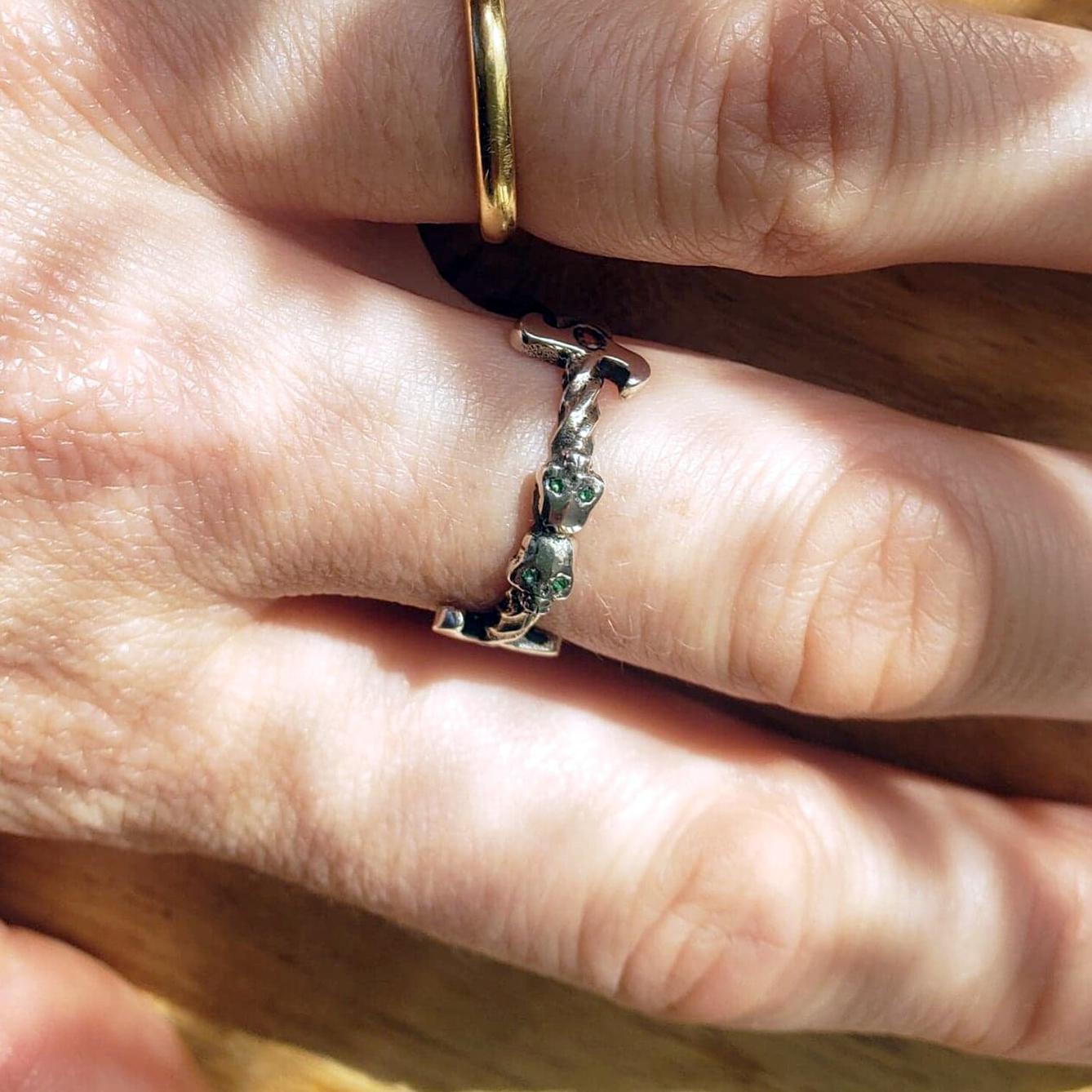 Hand wearing sterling silver dagger ring