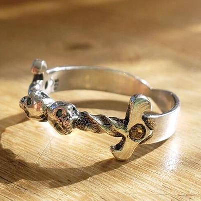 Sterling silver dagger ring with citrine stones and emerald eyes.
