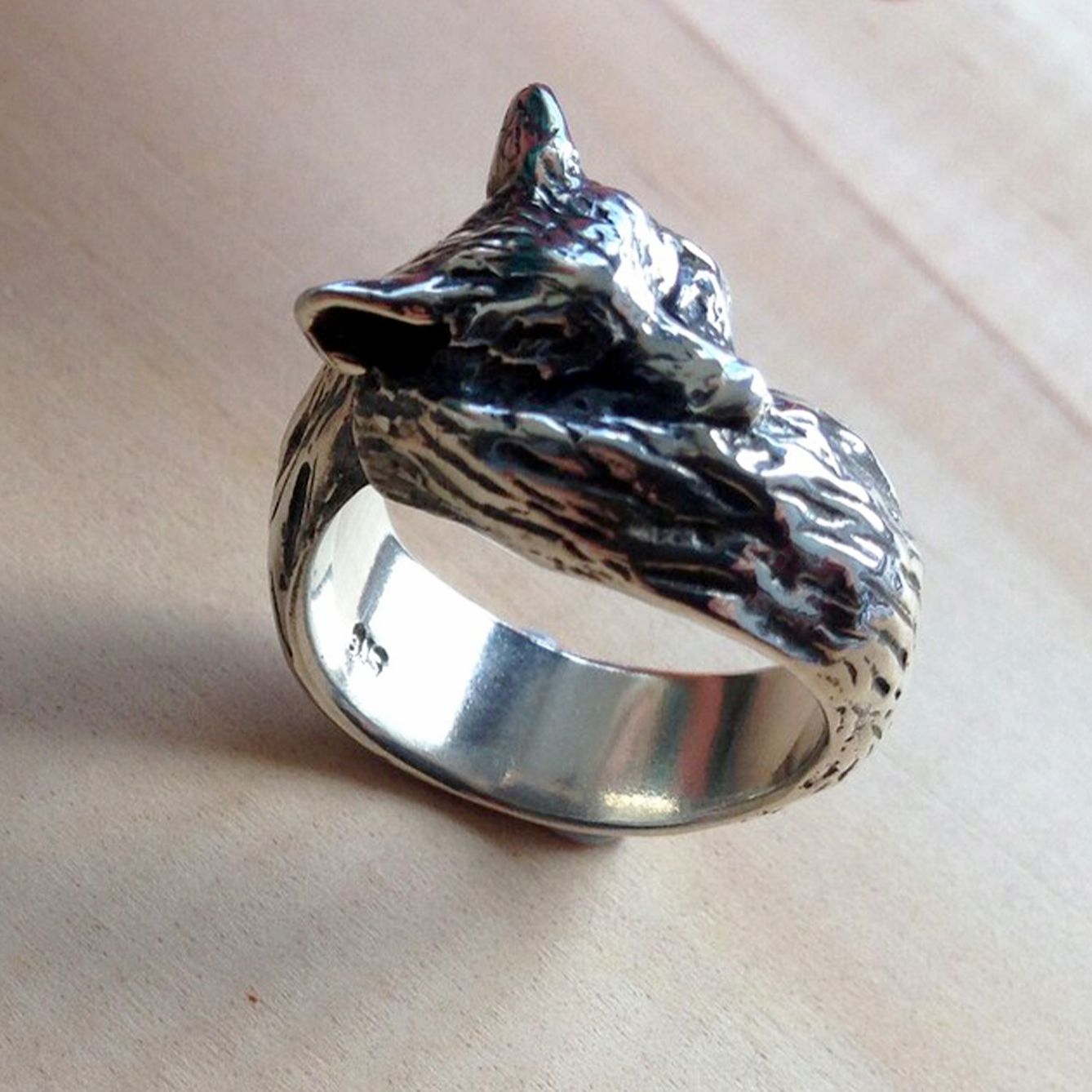 Three-quarter view of sterling silver fox ring