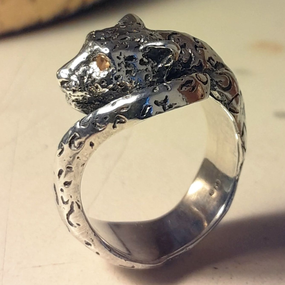 Sterling silver leopard ring with yellow citrine eyes.