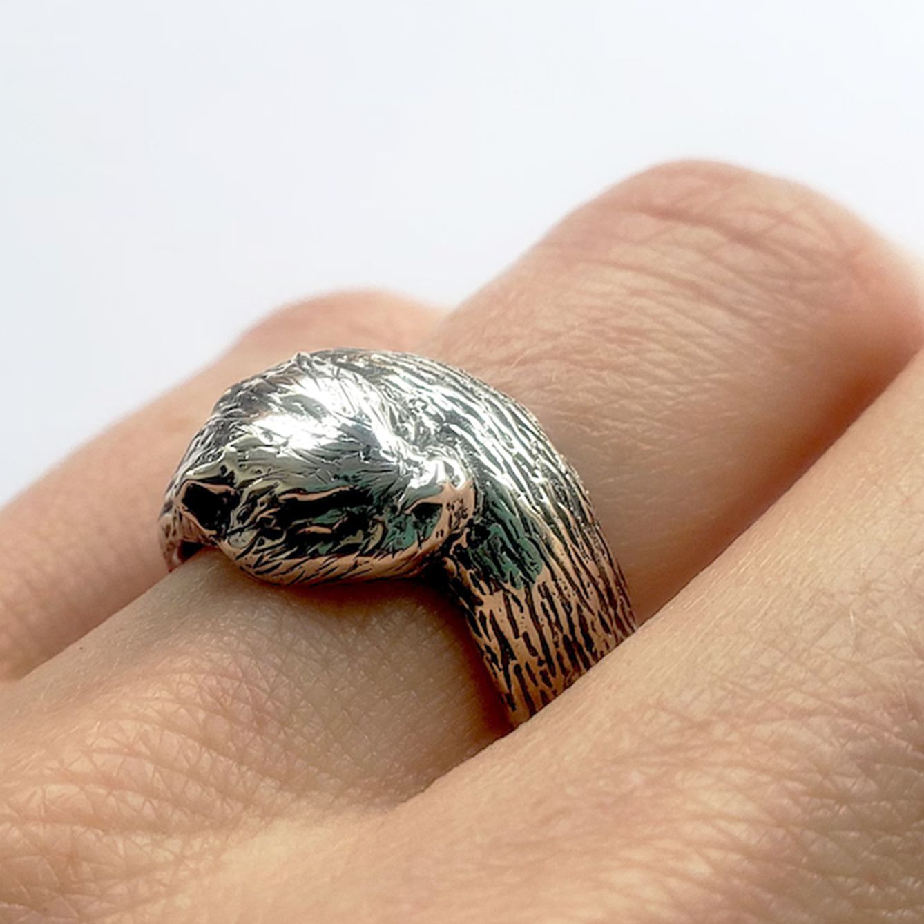 Otter ring worn on hand