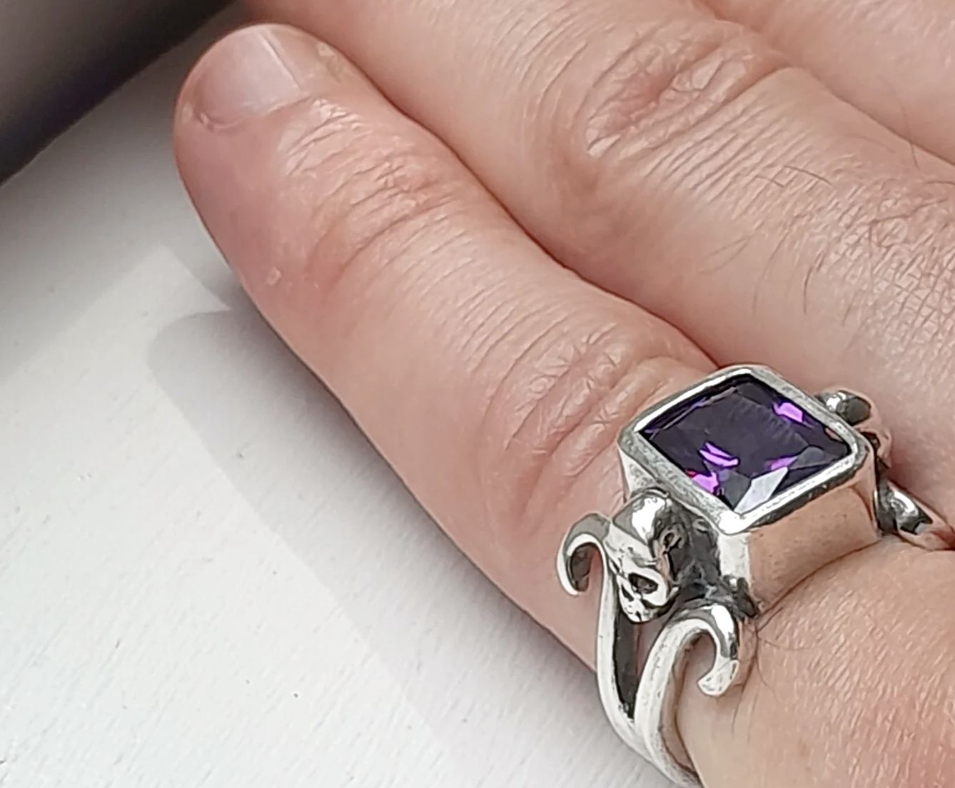 Skull ring worn on finger