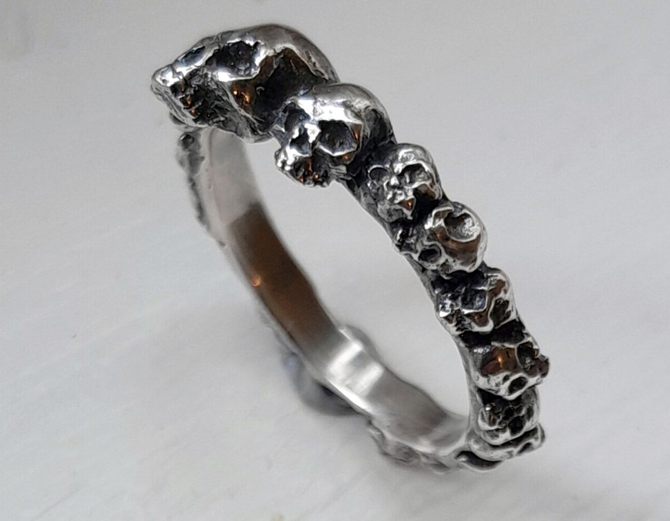 Sterling silver ring of skulls