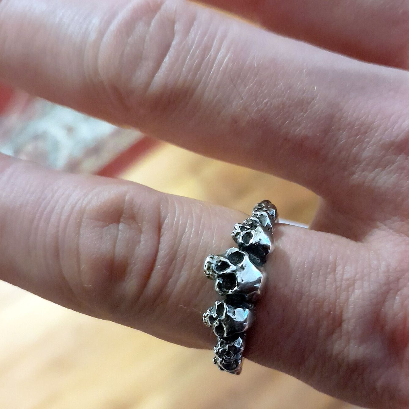 Ring of skulls worn on hand